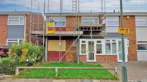 Freehold two floor semi-detached house requiring updating in London photo