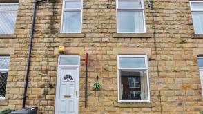 Mid terraced house in need of updating in Mirfield photo