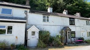 cottage is in need of modernisation in Mold photo