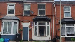 A Traditional mid-terraced house requiring repair in Dudley photo