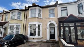 Terraced house in need or redecoration in Ilford photo