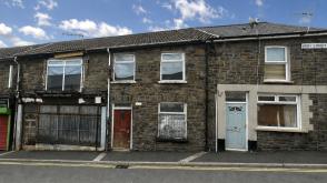 A mid terrace property in need of renovation in Ferndale photo
