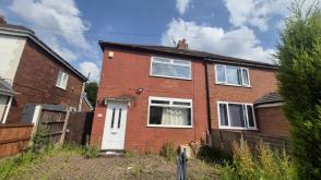 Semi-detached house which requires updating in Stockport photo