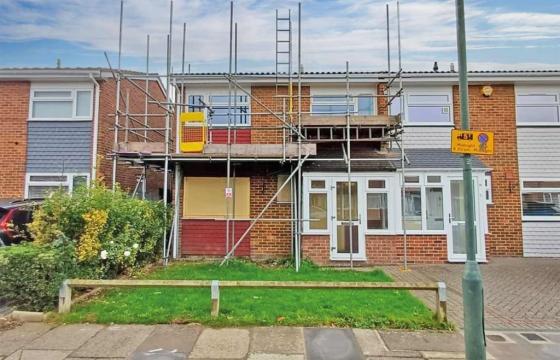 Freehold two floor semi-detached house requiring updating in London photo