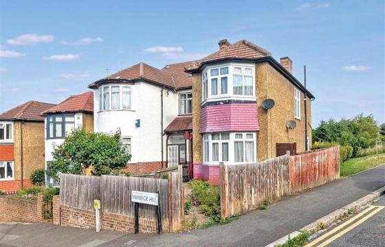 Freehold two floor semi-detached house requiring updating in London photo