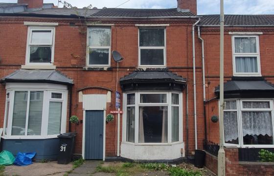 A Traditional mid-terraced house requiring repair in Dudley photo